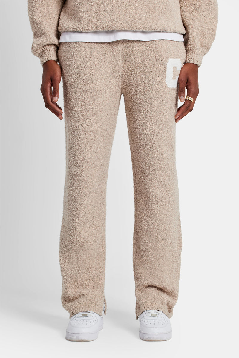 Male Model wearing textured knitted sweater tracksuit in beige