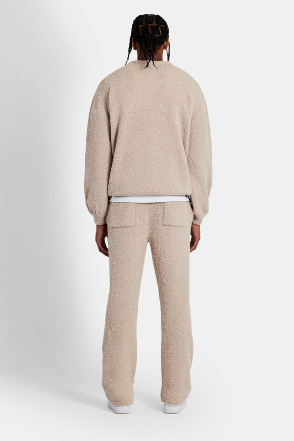 Male Model wearing textured knitted sweater tracksuit in beige