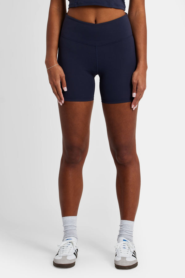 Female model wearing the ruched cycling shorty in navy