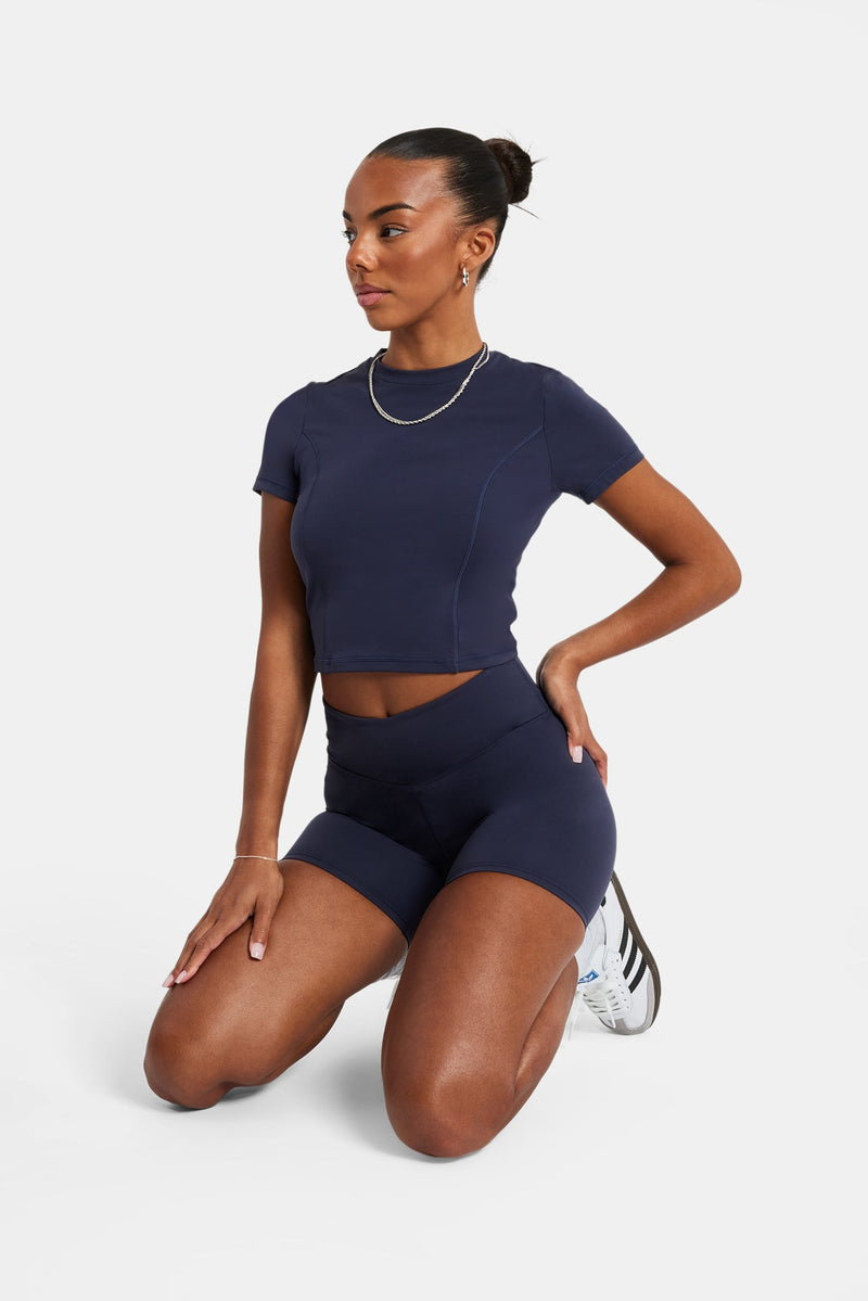 Female model wearing the ruched cycling shorty in navy