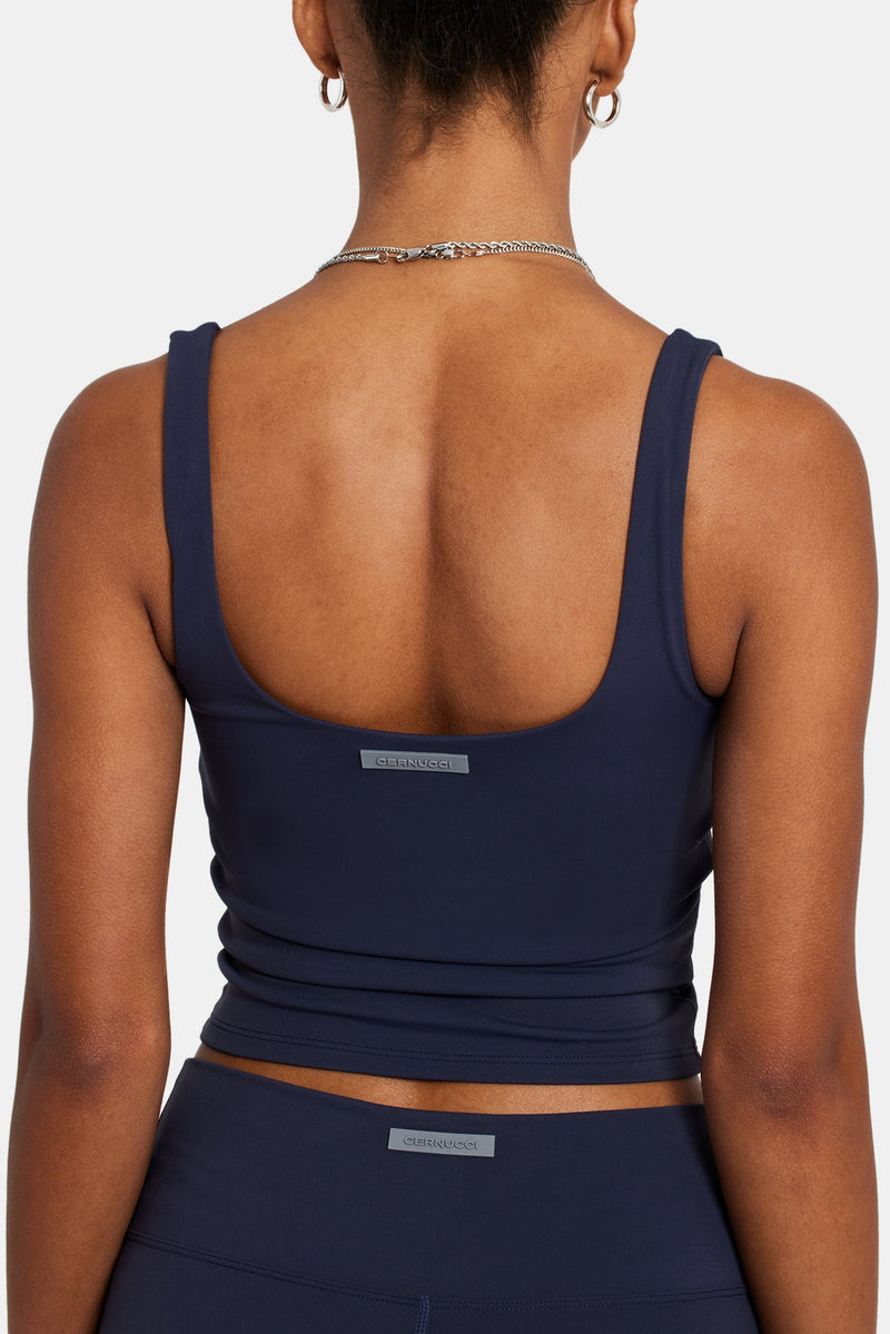 Female model wearing the square Neck top in navy