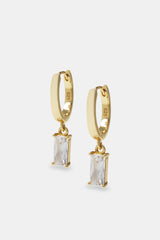 Iced clear gemstone huggie earrings on white background 