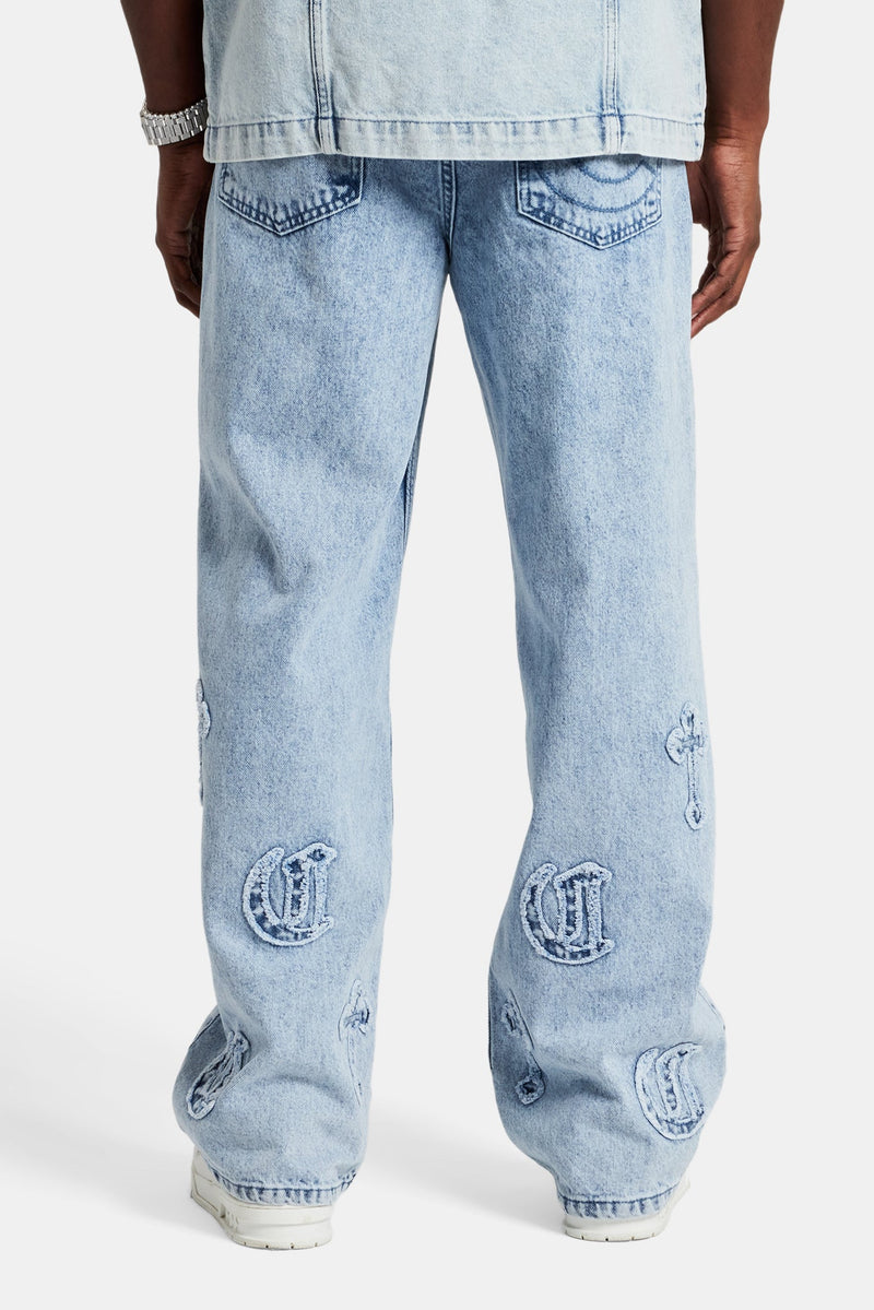 Raw Edge Applique Cross Baggy Jean - Light Blue