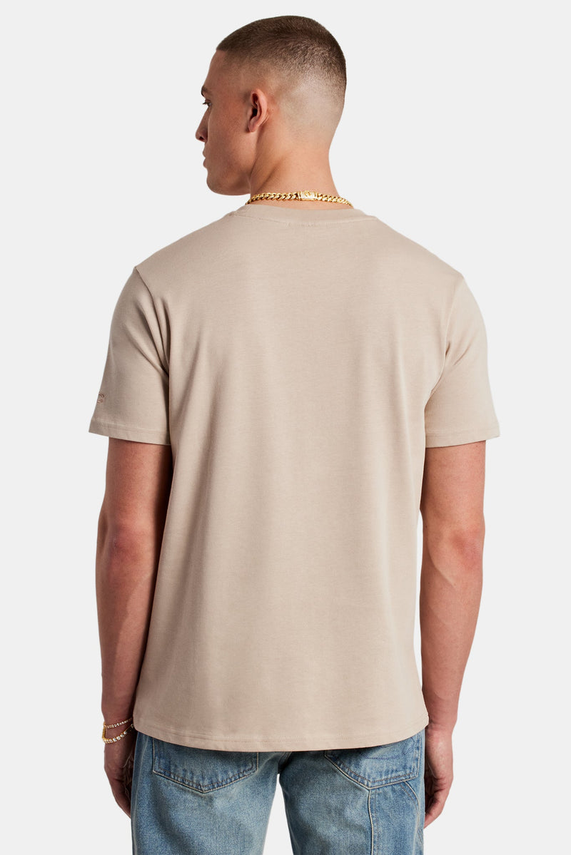 Male Model wearing Taupe T-shirt with C detail