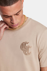 Male Model wearing Taupe T-shirt with C detail