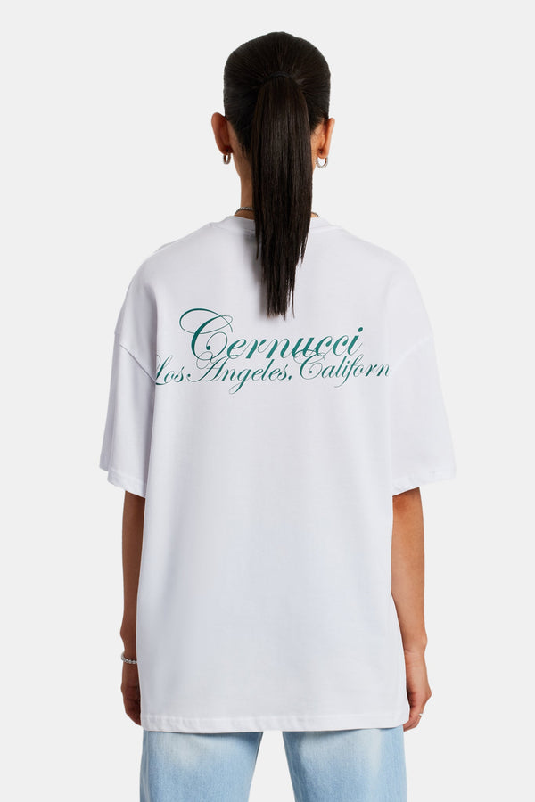Female model wearing the oversized California text print t-shirt in white 