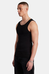 Man wearing black ribbed vest