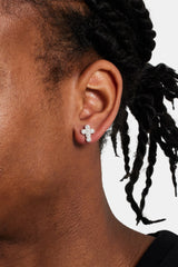 Male model wearing the iced cross stud earrings 