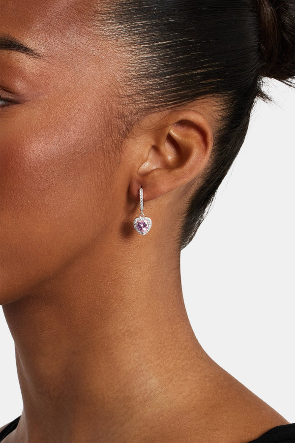 Female model wearing the pink heart drop earrings 