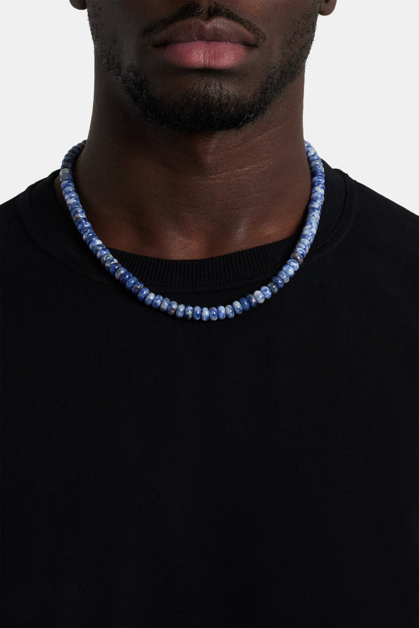 Male model wearing blue bead necklace