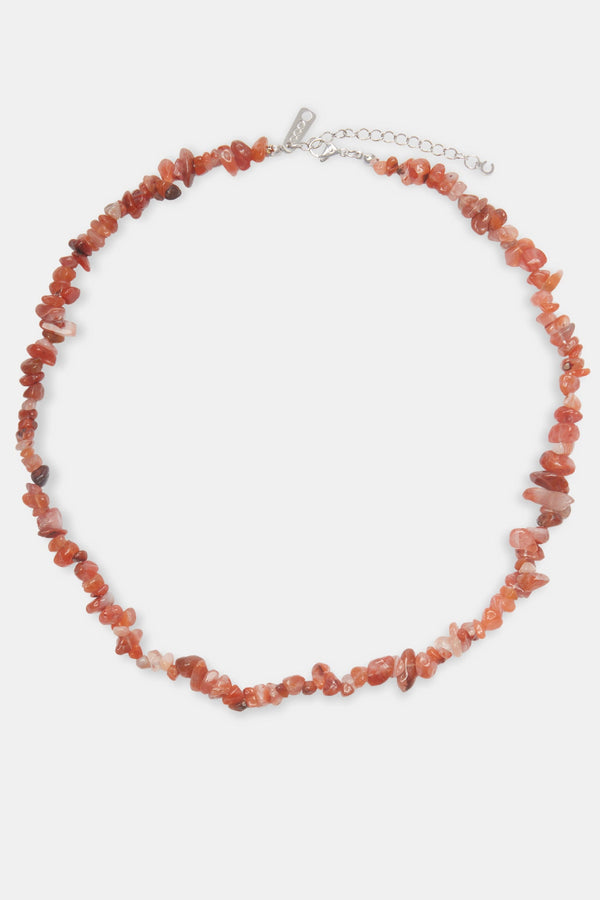 red agate bead necklace on white background