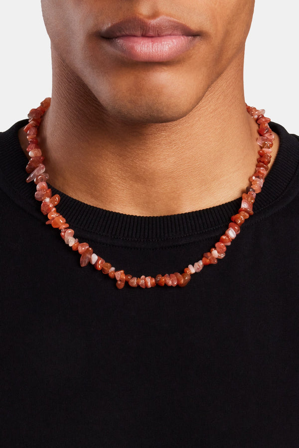 Male model wearing the red agate bead necklace