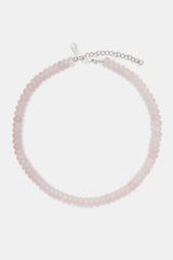 Rose quartz bead necklace in white background 